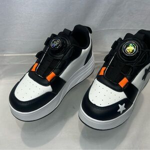 Stylish Kids Sneakers with Black, White, and Orange Accents
